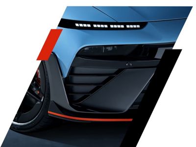 Vleugelvormige luchtgeleiders met Luminous Orange-accenten op de voorbumper van de Hyundai IONIQ 6 N.