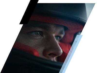 A close up image of a driver wearing a helmet inside a Hyundai N vehicle.