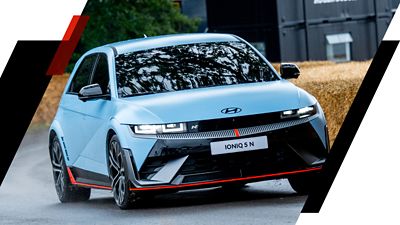 The all-electric Hyundai IONIQ 5 N driving through a curve. 