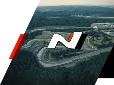 The Hyundai N badge with a racetrack in the background.