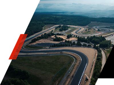 The Hyundai N badge with a racetrack in the background.