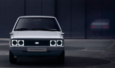 Front view of Heritage Series PONY EV with pixel-style lamps.