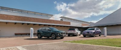 Hyundai electric and hybrid vehicle range showcased at a public EV charging location.