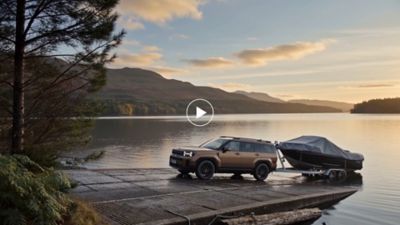  Hyundai Plug-in Hybrid with 1700 kg towing capacity pulling a boat trailer out of a lake.