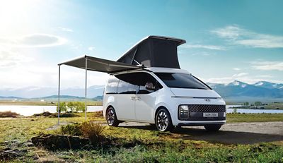 Hyundai STARIA Camper Concept all-electric premium recreational vehicle with pop-up roof and awning.