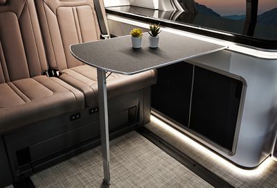 Interior view of the Hyundai STARIA Camper Concept showing the interior dining table and rear seats.