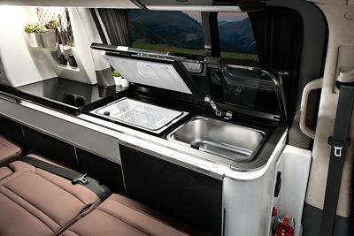 Interior view of the Hyundai STARIA Camper Concept showing the sink and refrigerator in the kitchen.