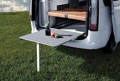  Hyundai STARIA Camper Concept with rear hatch open and pull out table extended out of back.
