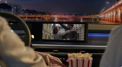 Rear-seat entertainment screen inside a Hyundai vehicle.
