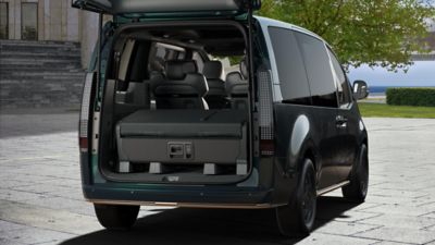 Hyundai STARIA Electric VIP rear cargo area with open tailgate.