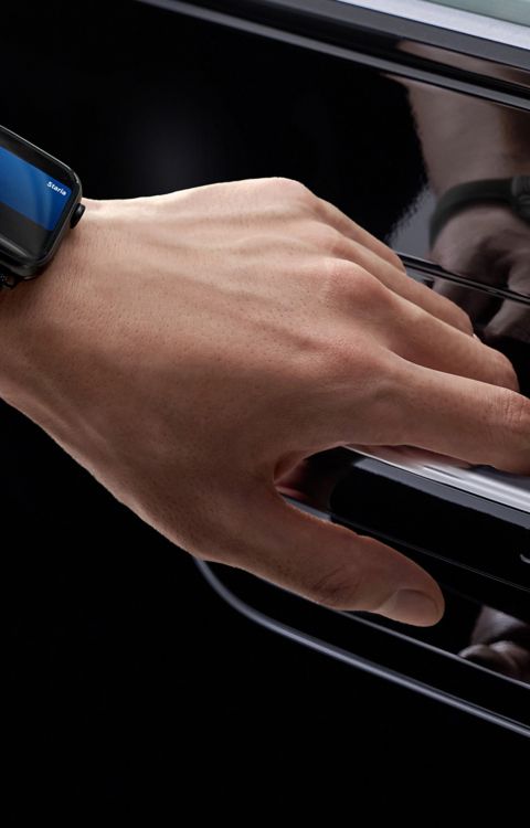 Hyundai STARIA Electric door handle being accessed with a smart key device, highlighting convenient entry
