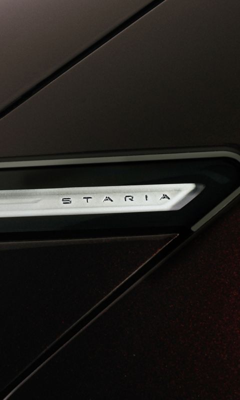 Close-up of the STARIA badge on the STARIA Electric exterior, emphasizing its futuristic branding.