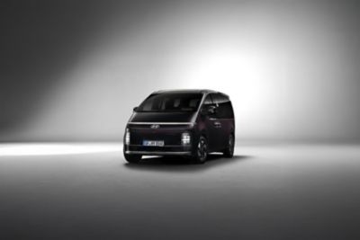 Front quarter view of the STARIA Electric in a studio setting, showcasing its futuristic design.