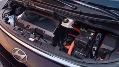 Front trunk area of the Hyundai STARIA Electric showcasing additional storage space.