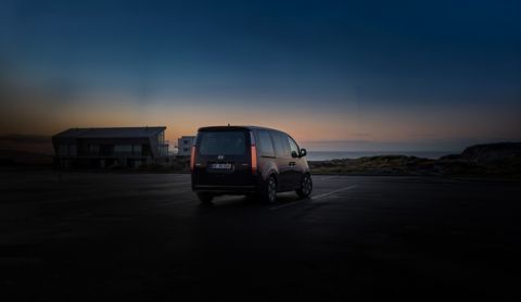 Hyundai Staria Electric rear view at sunset.