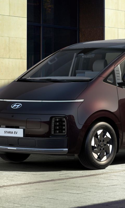 Front three-quarter view of a parked Hyundai STARIA Electric.
