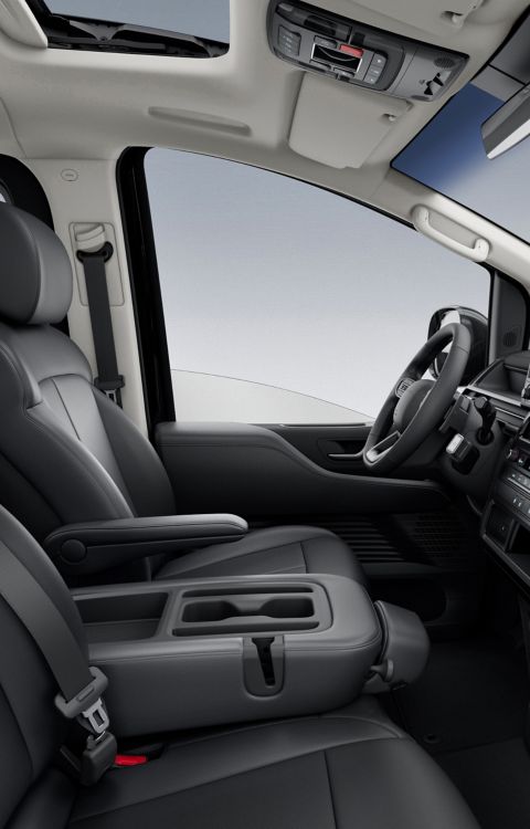 Hyundai STARIA Electric interior with open dashboard design, central display, and spacious front seating area.