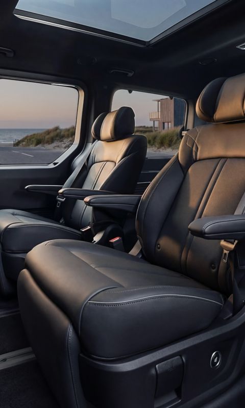Hyundai STARIA Electric second-row leather seats with armrests and panoramic view.