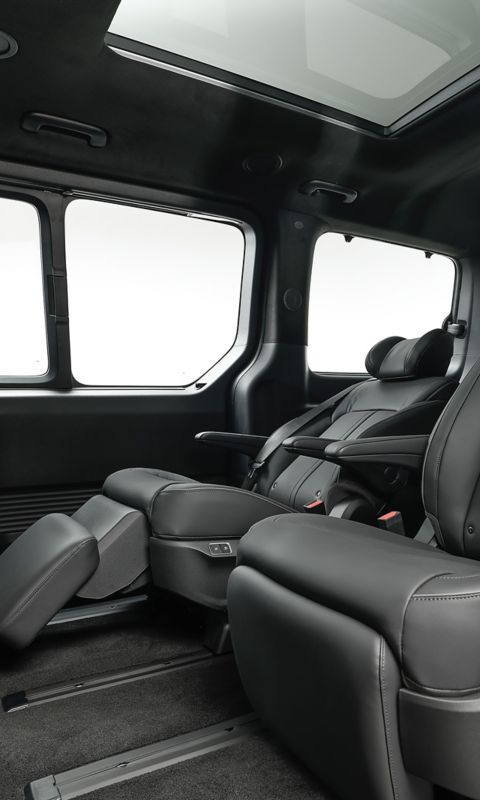 Spacious rear seating area of the STARIA Electric with individual seats and premium finishes.