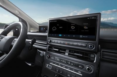 Hyundai STARIA Electric interior display showing live weather forecast and location-based information.