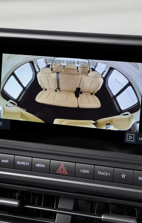 Hyundai STARIA Electric dashboard display with rear passenger camera and in-cabin talk communication feature.