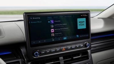 Hyundai STARIA Electric featuring Music services on the curved display.