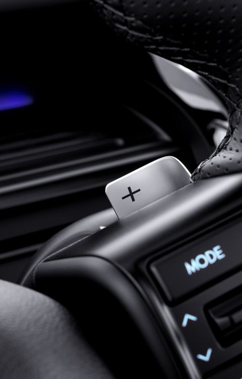 Close-up of Hyundai STARIA Electric steering wheel with integrated controls and paddle shifter.