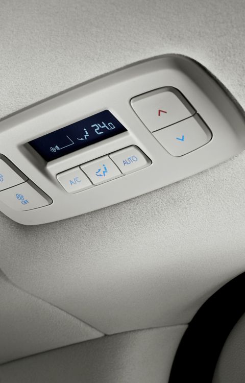 Hyundai STARIA Electric rear climate control panel with digital display and airflow settings.