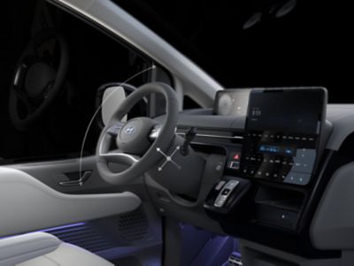 The tilting telescope steering wheel inside the Hyundai STARIA Hybrid multi-purpose vehicle.