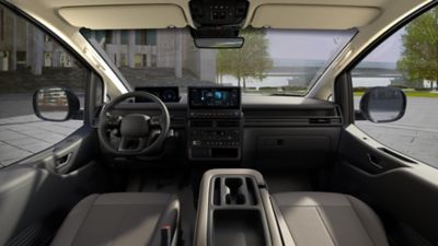 Hyundai STARIA Electric front cabin with digital displays, spacious interior, and practical storage designed for efficient fleet use.