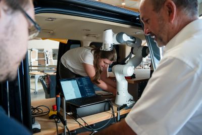 Anna Adamczyk adjusting a robot in the SVan.