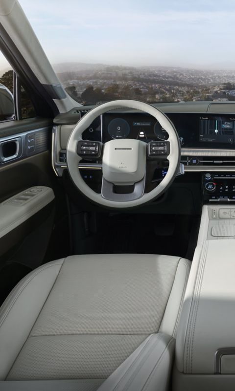 Hyundai STARIA Electric second-row leather seats with armrests and panoramic view.