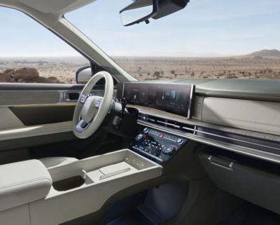  Interior of the Hyundai SANTA FE with a background view of the desert.