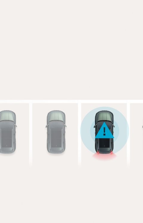 Blick von oben auf einen Hyundai IONIQ 6, der innerhalb einer Parkplatzmarkierung steht und eine Warnung aussendet.