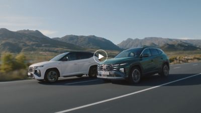 The Hyundai IONIQ 5 electric midsize CUV with its futuristic design at a charging station.