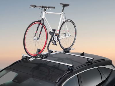 Accessoire Hyundai porte-vélo pro avec vélo sur le toit du TUCSON SUV.