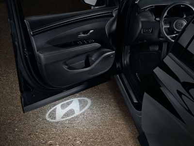  LED puddle lights Hyundai Genuine accessory in the tailgate of Hyundai TUCSON SUV.