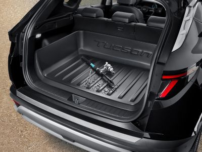 Trunk tray Hyundai Genuine accessory inside the  Hyundai TUCSON SUV.	