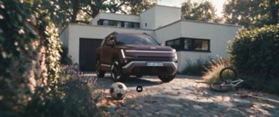 Hyundai TUCSON parked in a driveway with a residential home in the background.
