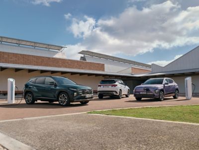 Hyundai electric and hybrid vehicle range showcased at a public EV charging location.