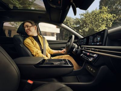The roomy interior of one of Hyundai's electric vehicles, due to no transmission and gear shifter.