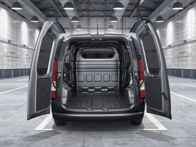 View of the STARIA Hybrid Van's back with open twin swing doors.