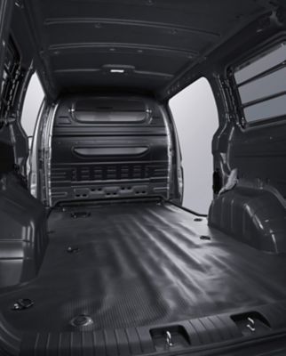 Cargo space partition with window in the Hyundai STARIA Hybrid Van.