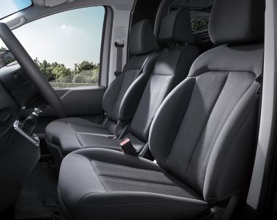 The spacious and comfortable driver and passenger seat in the STARIA Hybrid Van's cockpit.