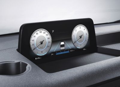 A view of the STARIA Premium's dashboard with the digital cluster display on top of it.