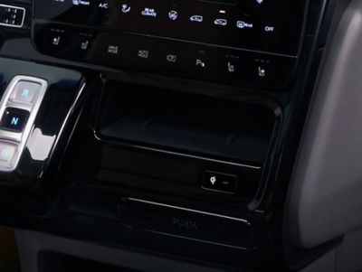 A picture of the Hyundai STARIA's  wireless charger tray with its cooling function.