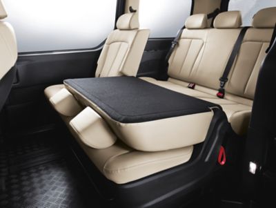 The second row seats in the Hyundai STARIA Hybrid Wagon fold completely flat.