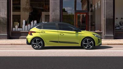 The Hyundai i20 parked on the streets with its head-turning sports stripes accessory.
