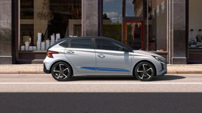 The Hyundai i20 parked in the streets with its racing stripes accessory.