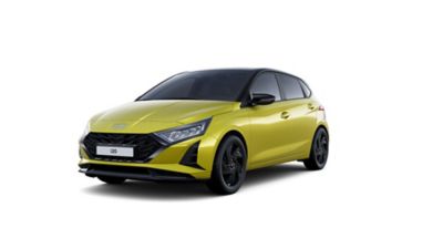 Front three-quarter view of a yellow Hyundai i20 Black Edition hatchback on a white background.